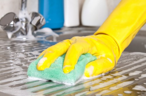 Technician treating stains on a fabric sofa in a beach home