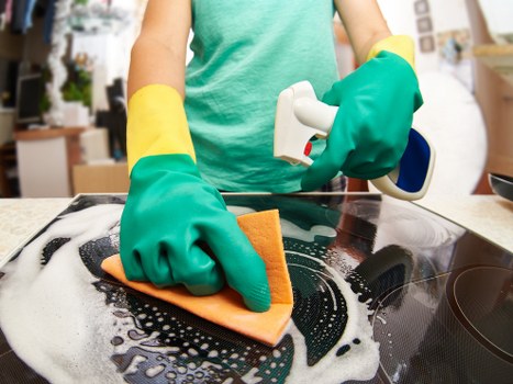Technician wearing PPE during carpet cleaning work