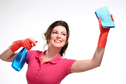 Technician performing carpet cleaning in a humid Nags Head property