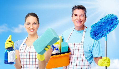 Staff member handling cleaning chemicals safely and correctly